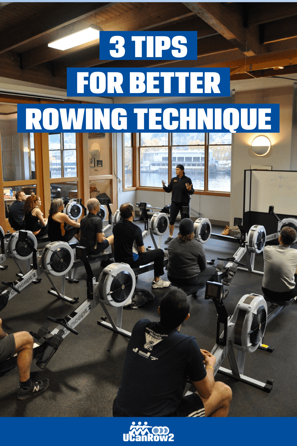 Group of people listening to a master instructor on how to improve indoor rowing technique