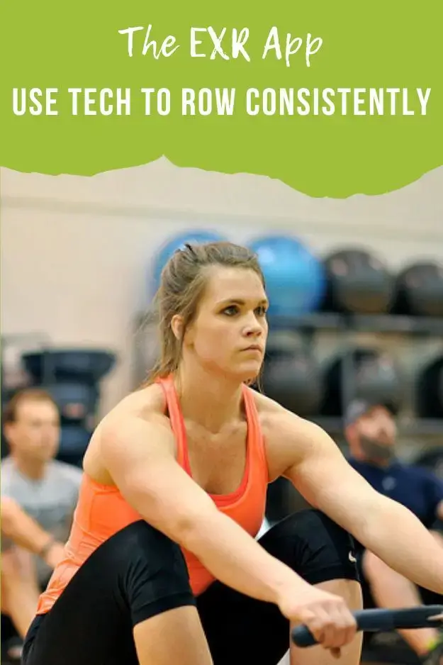A woman on a Concept2 rowing machine is focused on her screen as she prepares to row.